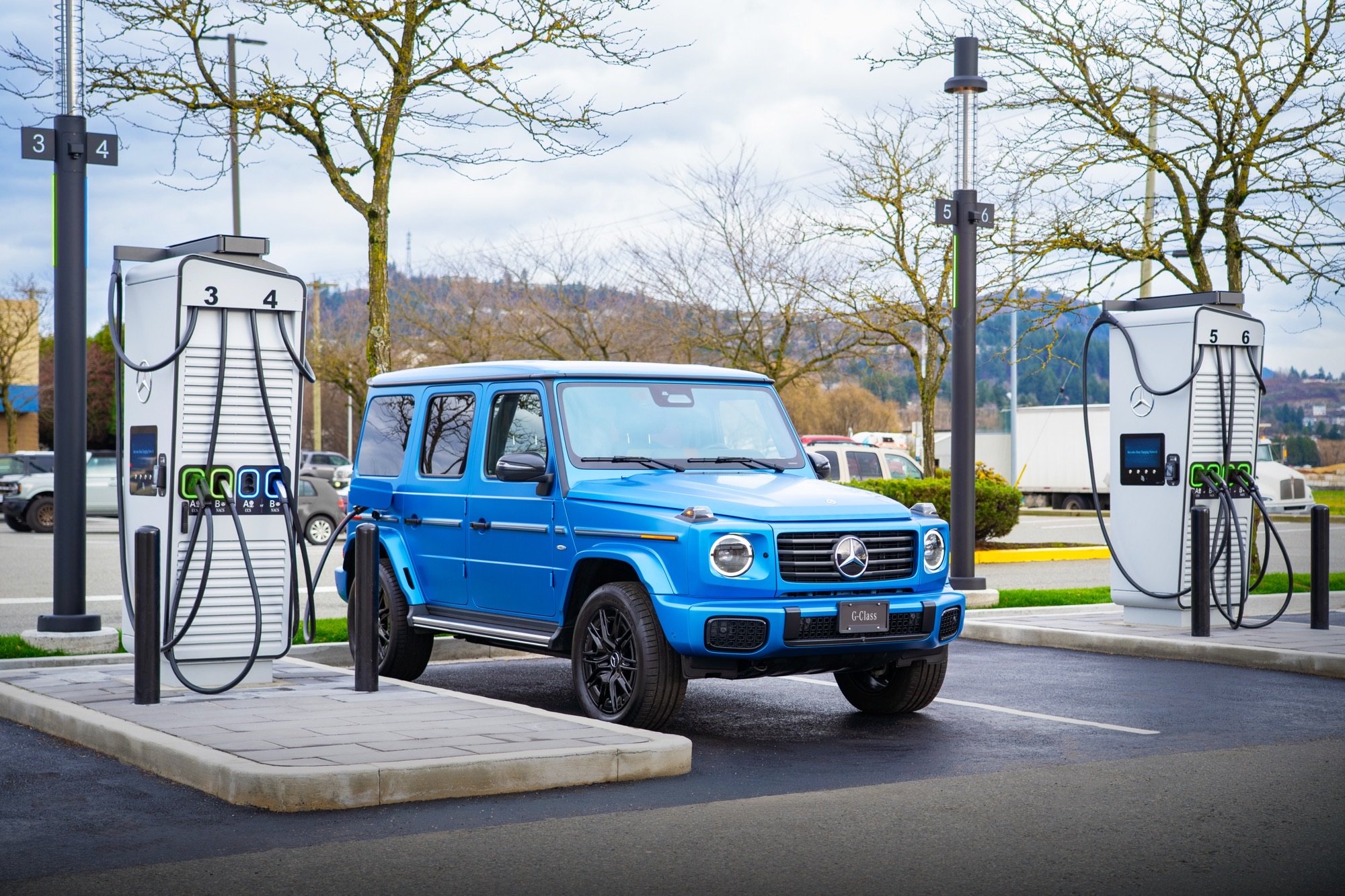 2025 Mercedes-Benz G 580 charging at a stall in a parking lot.