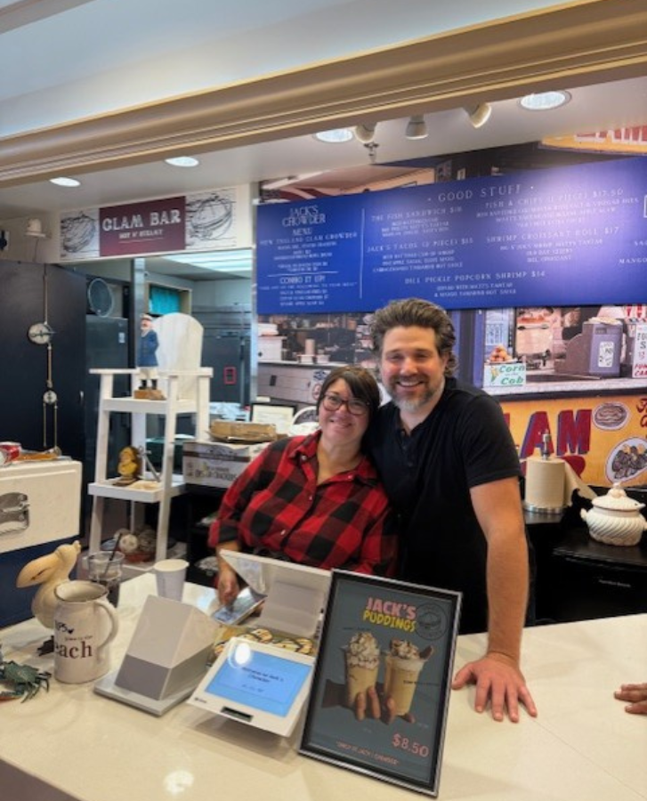 Brennan and Romero standing behind the service counter at Jack's Fish and Chips.