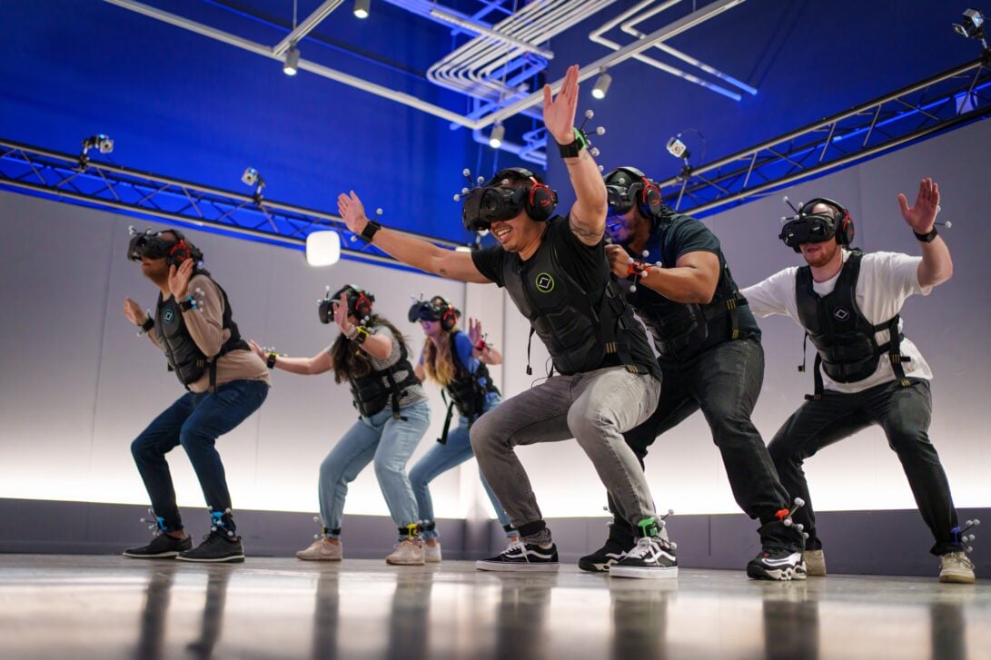 Group of six in a virtual reality room at sandbox VR