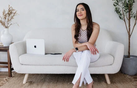 vivian garcell portrait on white couch